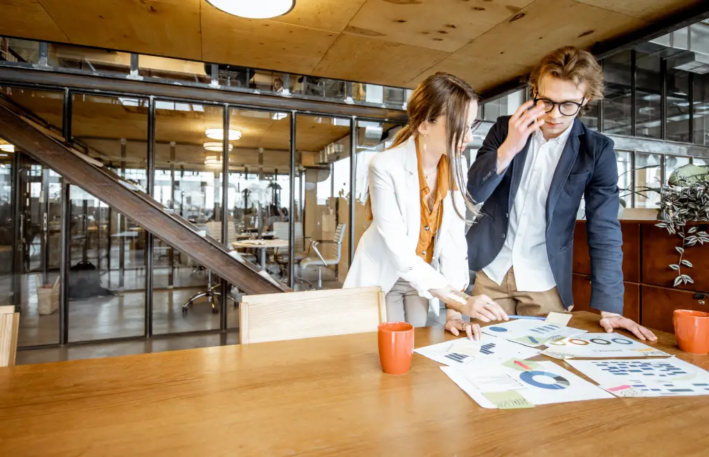 two people looking at charts to estimate time