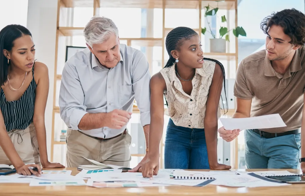 a team of four people estimating time for a project